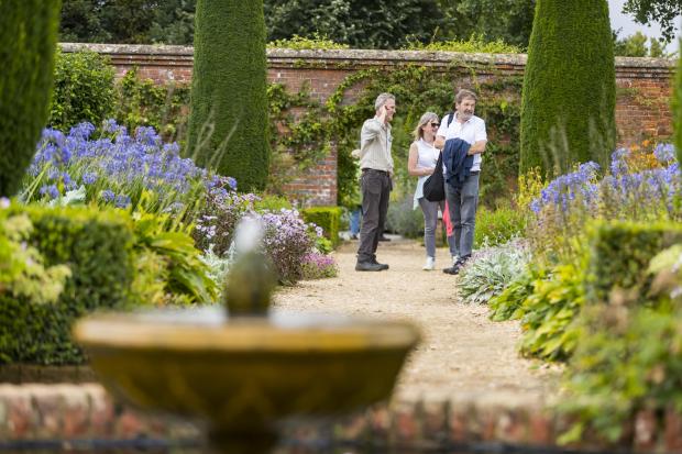 Hampshire Chronicle: Visitors on a garden tour at Mottisfont, Hampshire